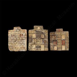 Plaques from the “Town Mosaic”, a larger composition of faience plaques that decorated a wooden object, depicting house façades in different building styles, the natural terrestrial and marine landscape, human figures and weaponry. From Knossos, 1700-1600 BC.