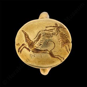 Gold ring depicting the journey of a goddess with a griffin from Archanes Phourni, 1600-1450 BC.
